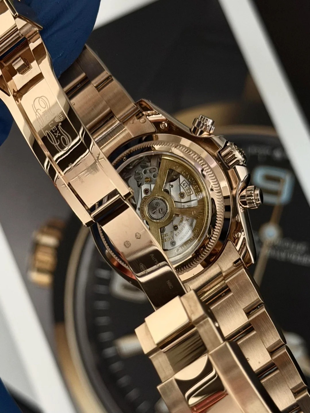 Rose gold Daytona caseback showing the exposed automatic movement through the exhibition window
